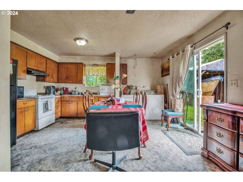 22370 South Bartholomew Road Estacada, OR 97023 - Photo 20 of 24 a living room with stainless steel appliances kitchen island granite countertop furniture and a kitchen view