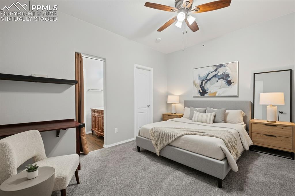 3214 Apogee View Colorado Springs, CO 80906 - Photo 15 of 33 a bedroom with a bed and window