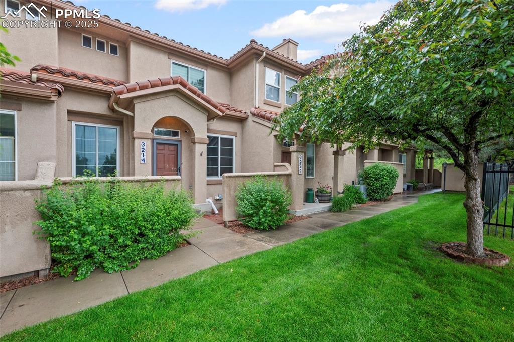 3214 Apogee View Colorado Springs, CO 80906 - Photo 2 of 33 a front view of a house with garden