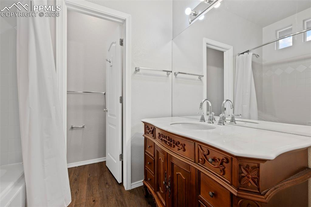 3214 Apogee View Colorado Springs, CO 80906 - Photo 29 of 33 a bathroom with a sink a vanity and a mirror