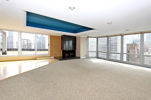 21 West Goethe Street, Unit 19C Chicago, IL 60610 - Photo 3 of 14 a view of an empty room with a large window