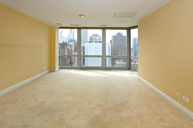21 West Goethe Street, Unit 19C Chicago, IL 60610 - Photo 7 of 14 a view of an empty room with a window