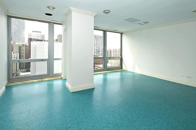 21 West Goethe Street, Unit 19C Chicago, IL 60610 - Photo 8 of 14 a view of empty room with wooden floor and fan