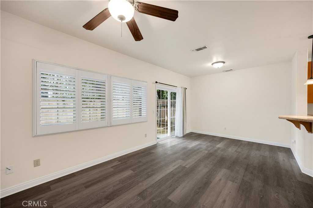 93 Kansas Street, Unit 705 Redlands, CA 92373 - Photo 19 of 33 wooden floor in an empty room with a window