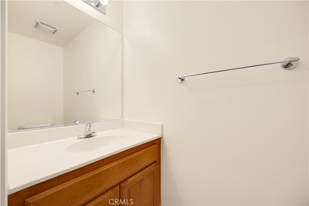 93 Kansas Street, Unit 705 Redlands, CA 92373 - Photo 21 of 33 a bathroom with a sink and a mirror