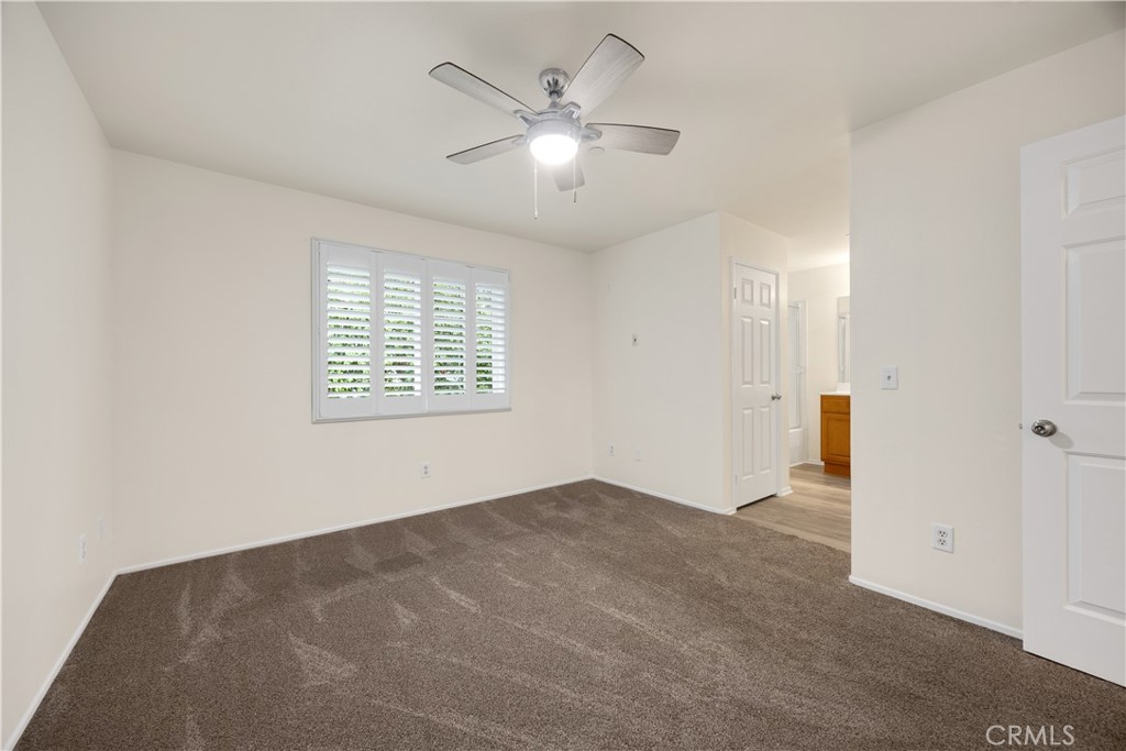 93 Kansas Street, Unit 705 Redlands, CA 92373 - Photo 23 of 33 an empty room with fan and windows