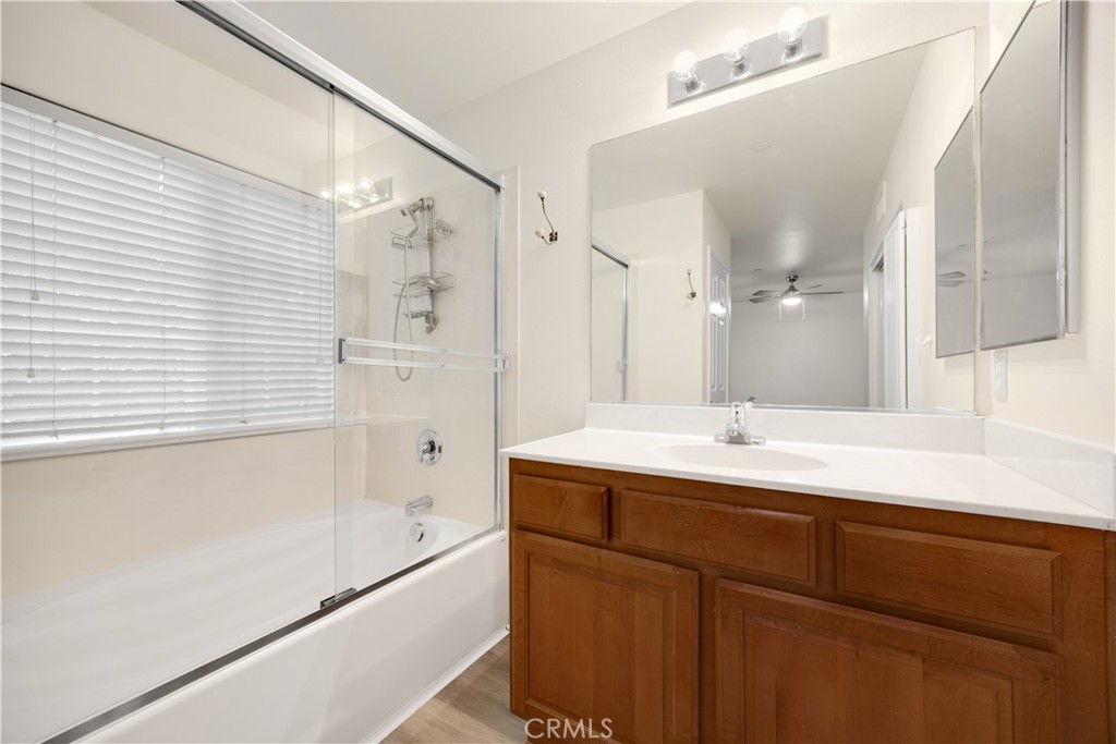 93 Kansas Street, Unit 705 Redlands, CA 92373 - Photo 25 of 33 a bathroom with a double vanity sink mirror and a bathtub
