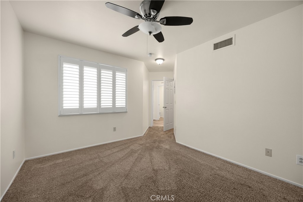 93 Kansas Street, Unit 705 Redlands, CA 92373 - Photo 28 of 33 a view of an empty room with a window