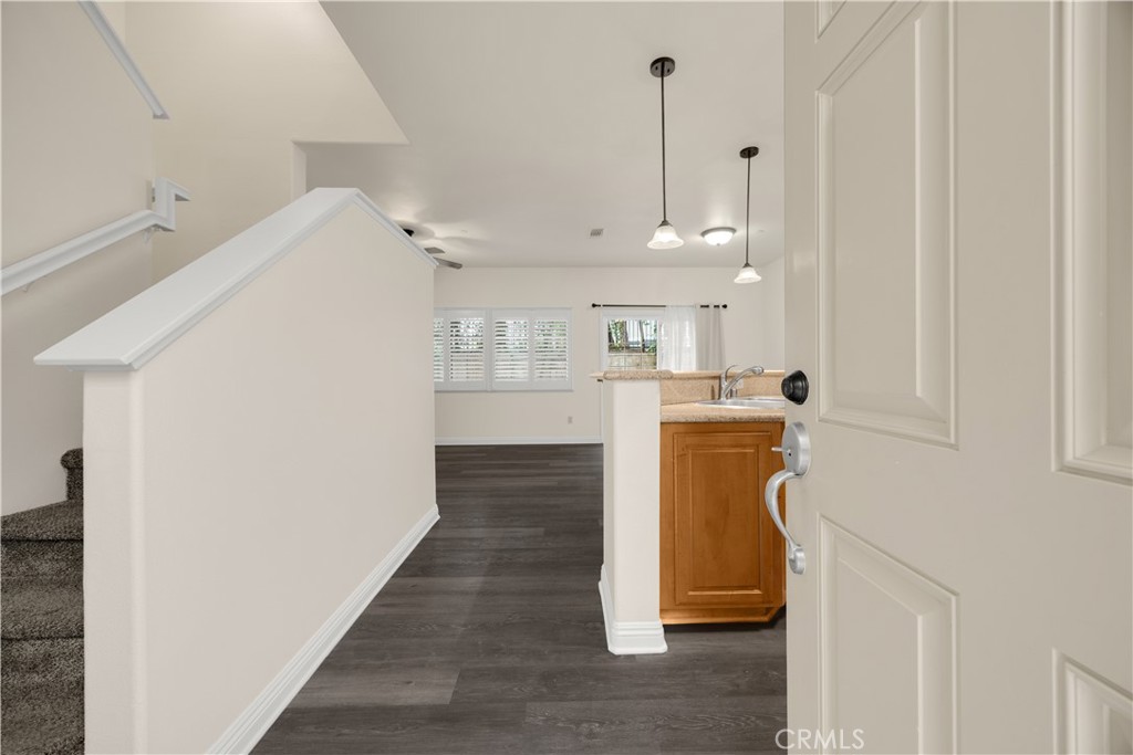 93 Kansas Street, Unit 705 Redlands, CA 92373 - Photo 3 of 33 a view of a kitchen with white cabinets