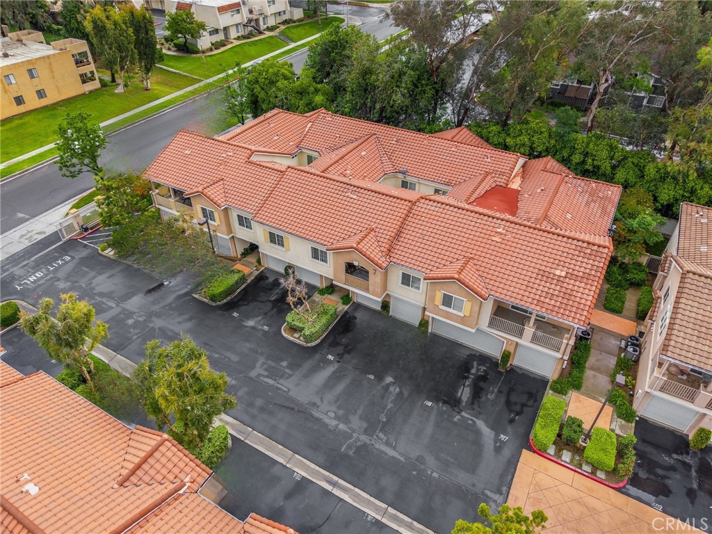93 Kansas Street, Unit 705 Redlands, CA 92373 - Photo 33 of 33 an aerial view of a house with garden space and street view