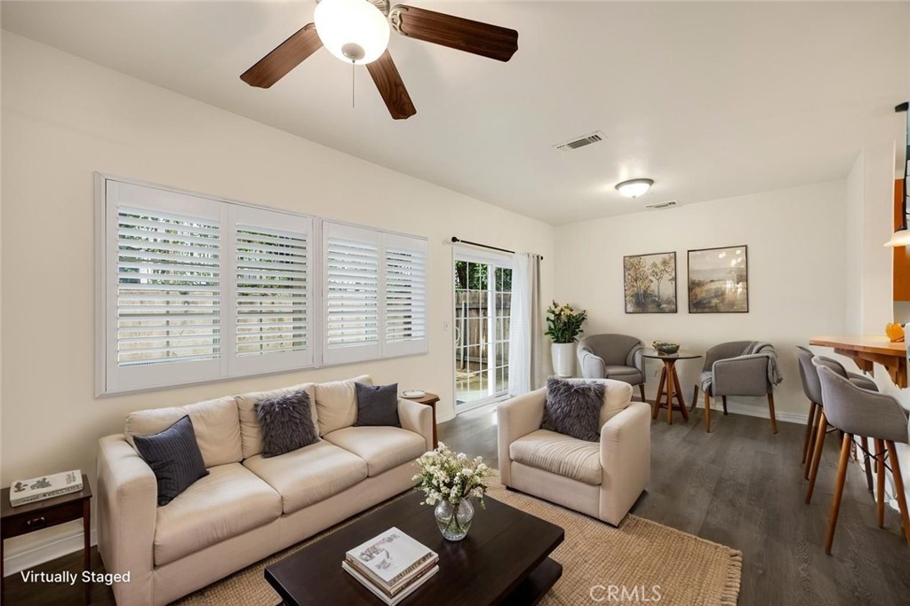 93 Kansas Street, Unit 705 Redlands, CA 92373 - Photo 5 of 33 a living room with furniture and a large window