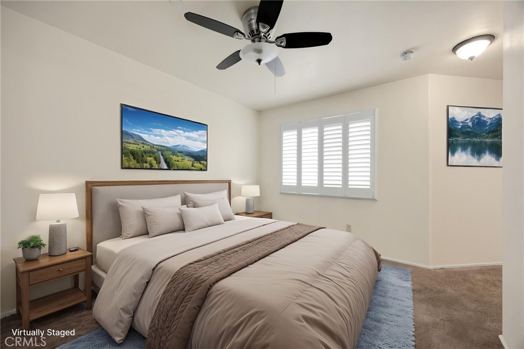 93 Kansas Street, Unit 705 Redlands, CA 92373 - Photo 7 of 33 a bedroom with a large bed and a window