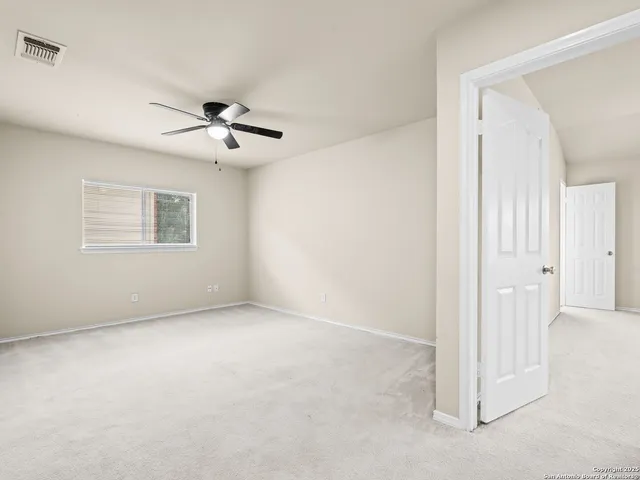 a view of a big room with carpet