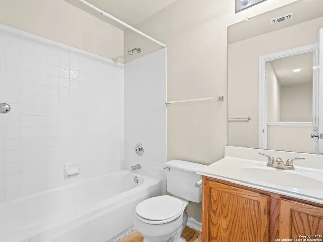 a bathroom with a sink a toilet and a bathtub