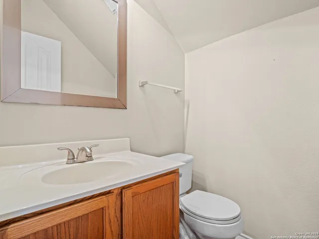 a bathroom with a sink toilet and vanity