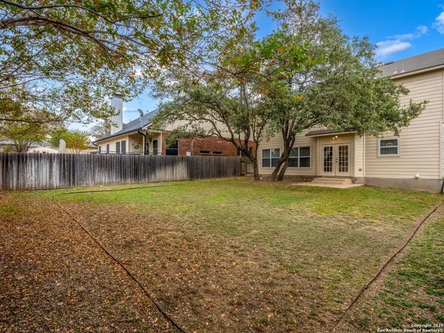 a backyard of a house with lots of green space