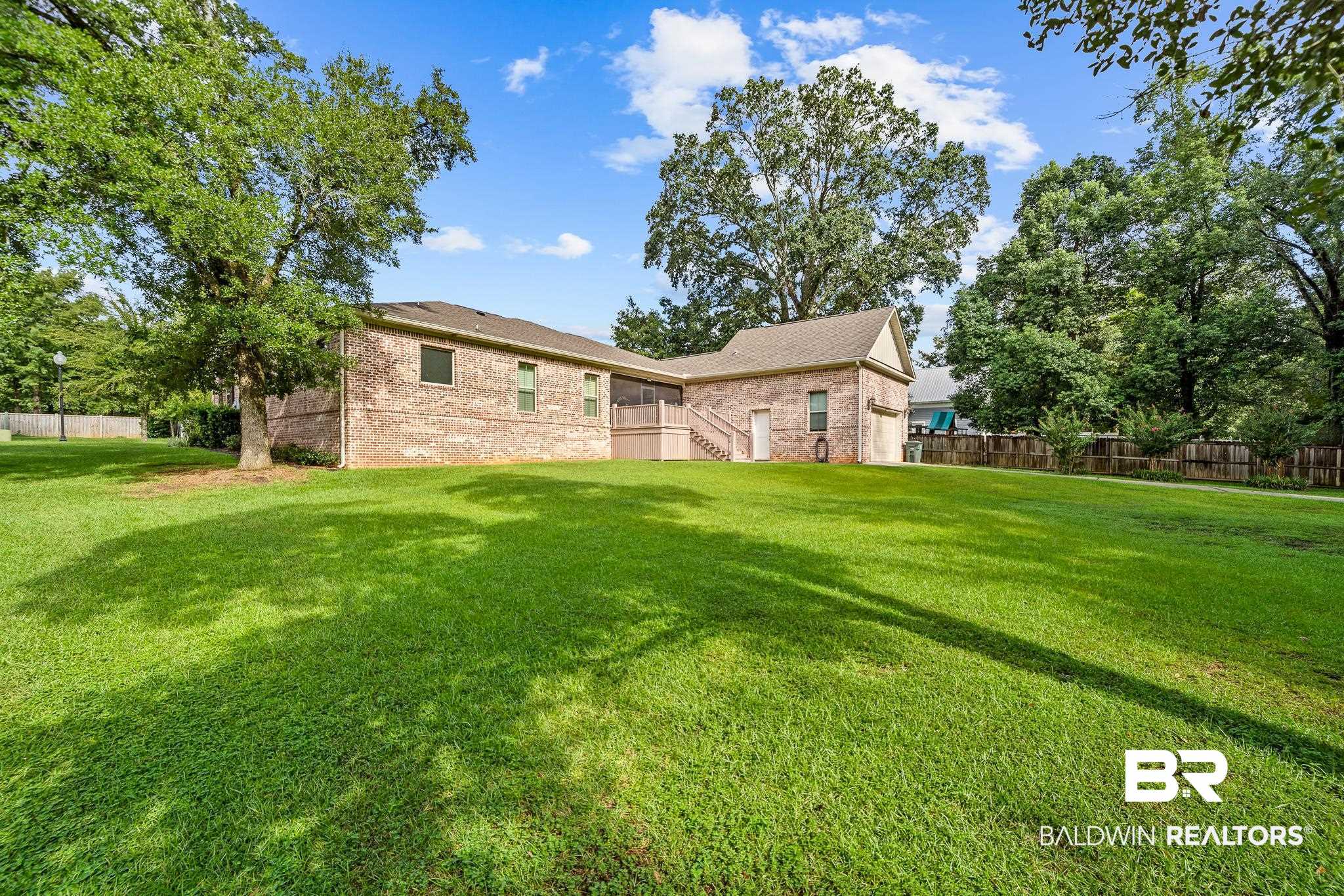 29530 St John Street Daphne, AL 36526 - Photo 33 of 38 Rear view of property featuring a yard