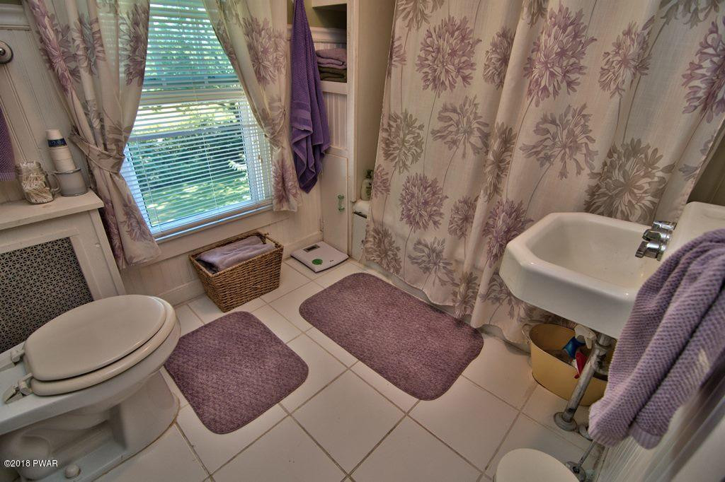 72 Hemlock Road Lake Ariel, PA 18436 - Photo 46 of 48 a bathroom with a toilet sink and tub