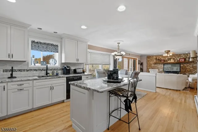 a kitchen with a table chairs stove and cabinets