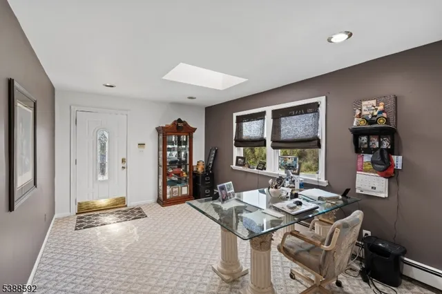 a view of a livingroom with furniture and window