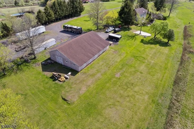 a view of a yard with swimming pool