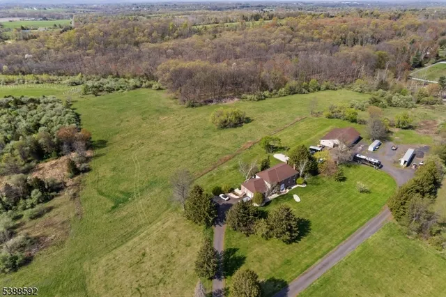 an aerial view of a houses with outdoor space