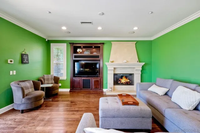 a bedroom with a large bed and a tv