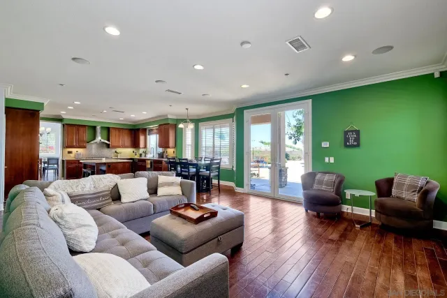 a bathroom with a tub a sink and a large mirror