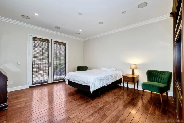 a spacious bathroom with a tub sink and mirror
