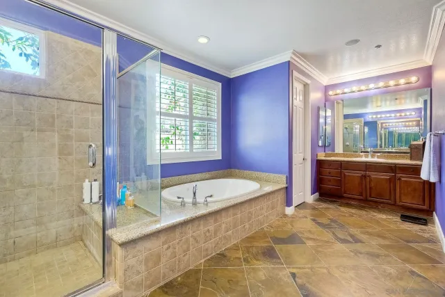 a utility room with sink dryer and washer