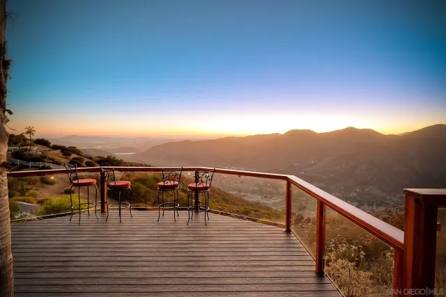 a front view of a house with a yard and a garage