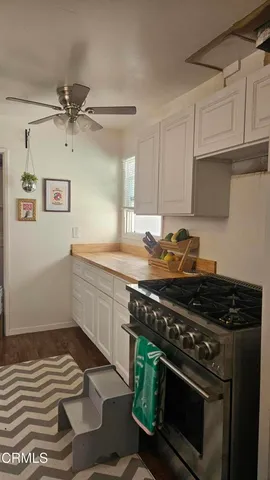 a kitchen with a stove and a sink