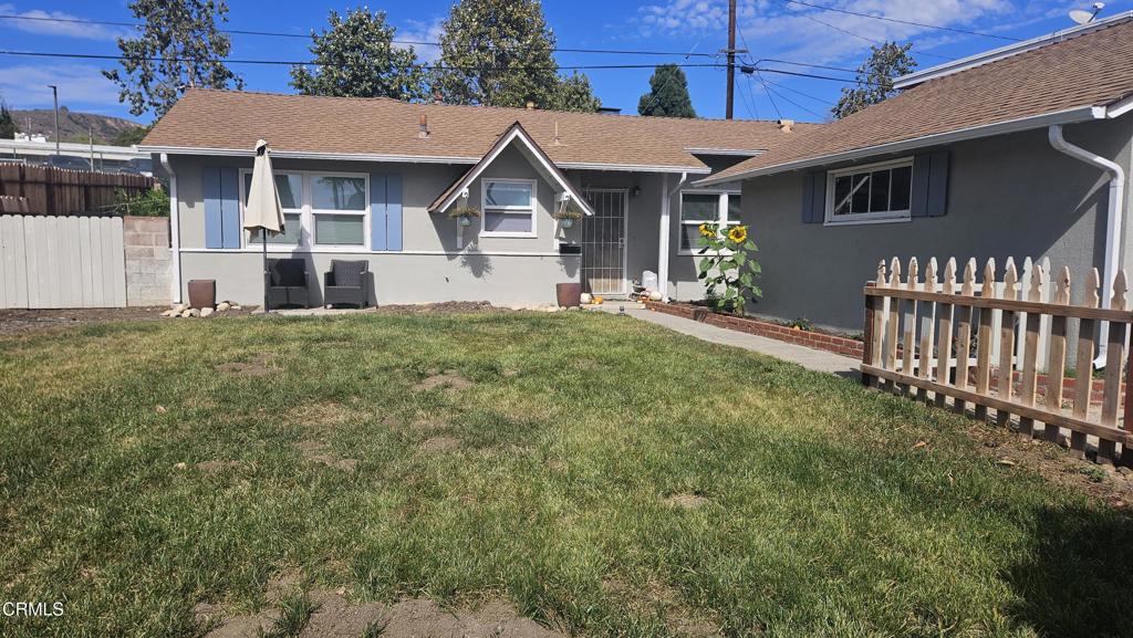6005 Sutter Street Ventura, CA 93003 - Photo 10 of 11 a front view of a house with a yard