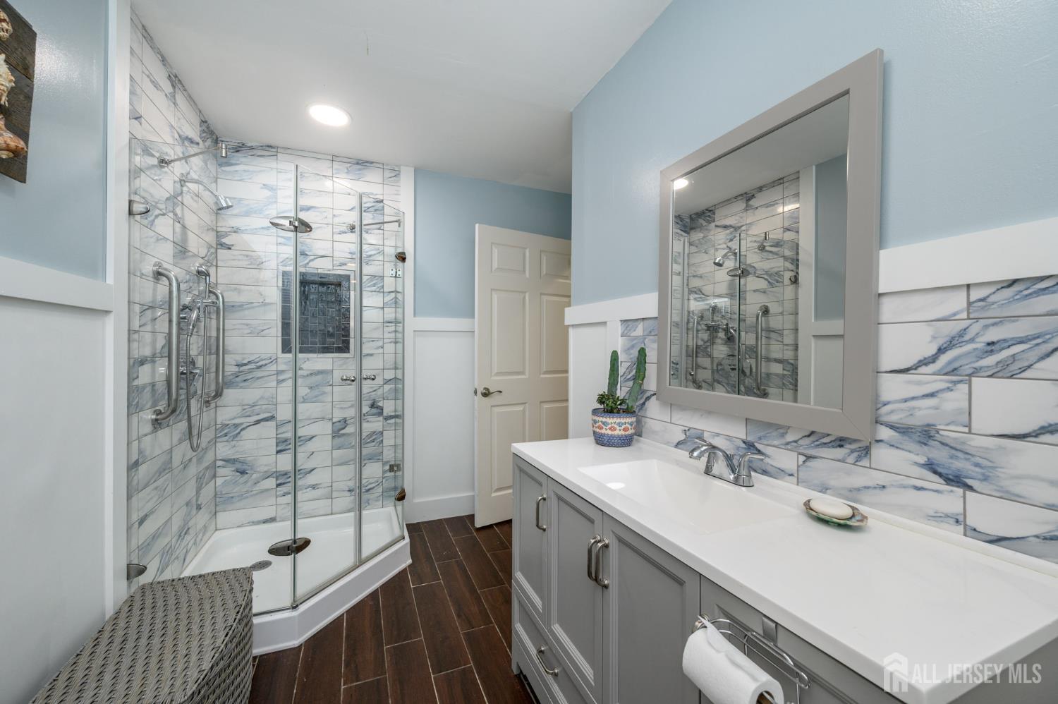 16 Pinewood Lane Washington, NJ 07882 - Photo 12 of 45 a bathroom with a sink double vanity and a shower