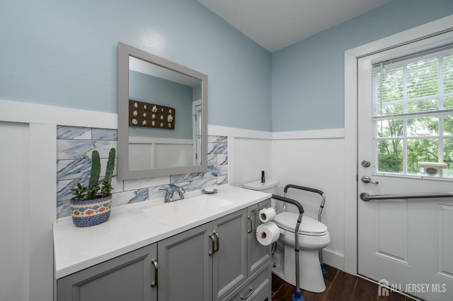 16 Pinewood Lane Washington, NJ 07882 - Photo 13 of 45 a bathroom with a sink a toilet and with mirror