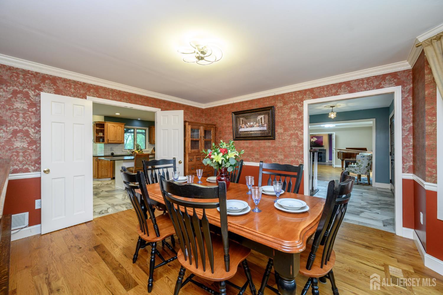 16 Pinewood Lane Washington, NJ 07882 - Photo 16 of 45 a view of a dining room with furniture and wooden floor