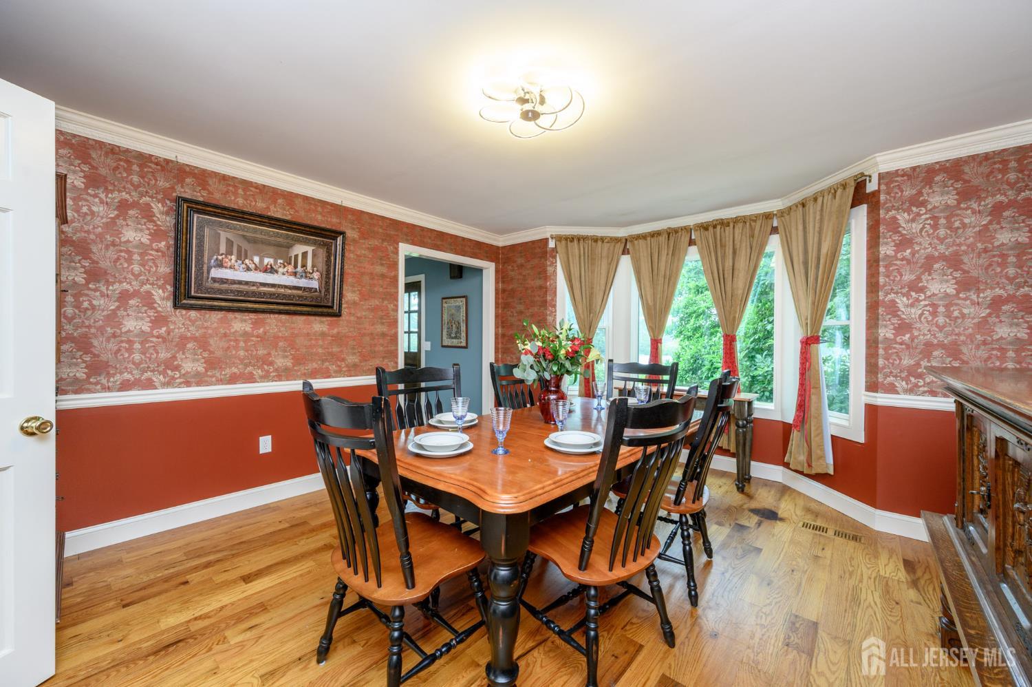 16 Pinewood Lane Washington, NJ 07882 - Photo 17 of 45 a view of a dining room with furniture window and wooden floor