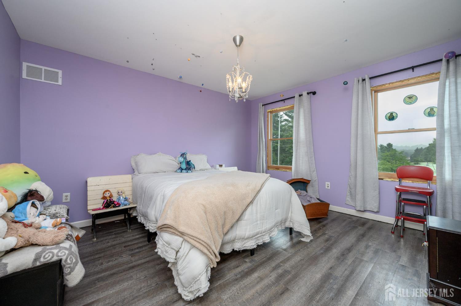 16 Pinewood Lane Washington, NJ 07882 - Photo 30 of 45 a spacious bedroom with a bed and wooden floor