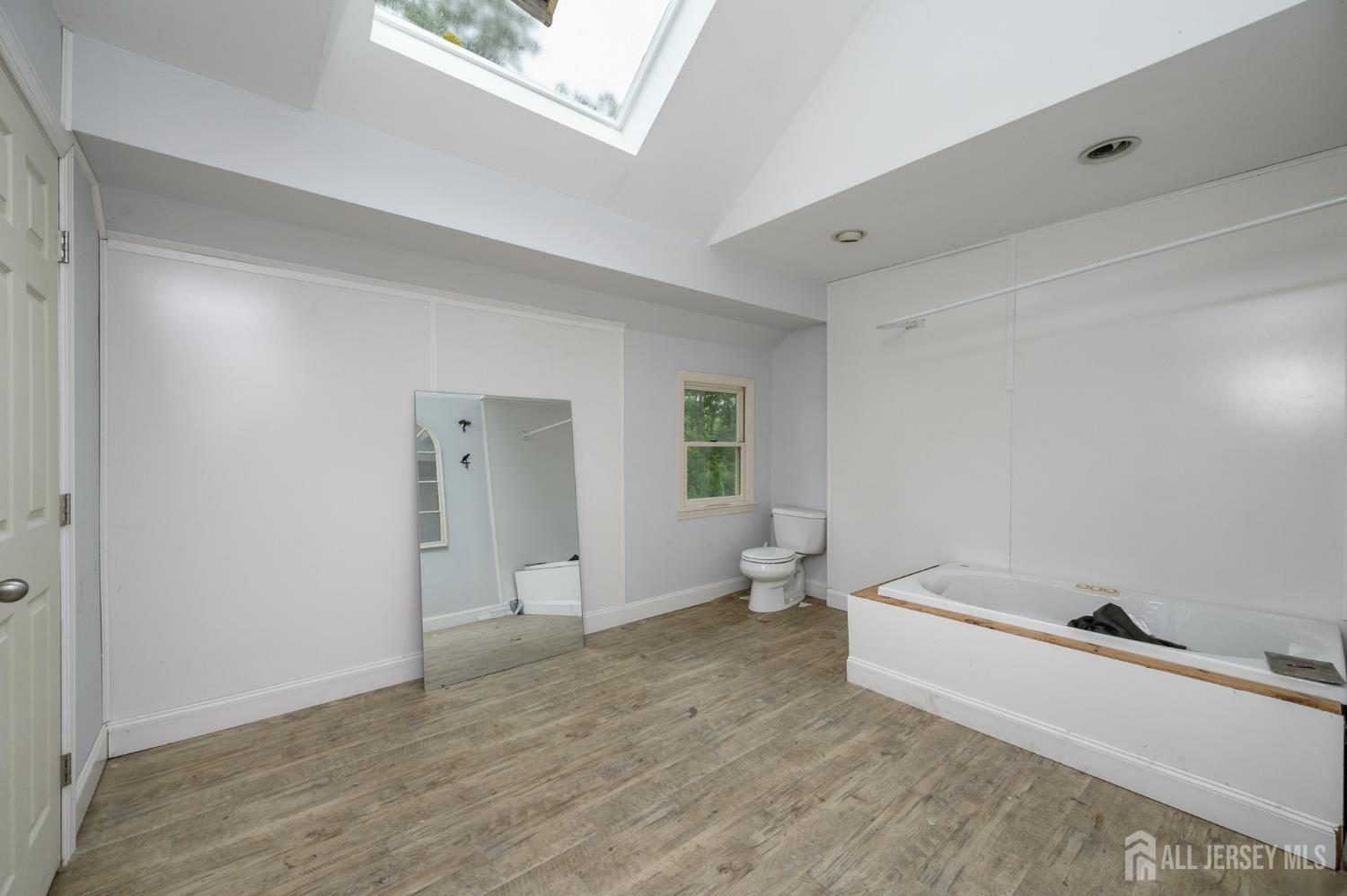 16 Pinewood Lane Washington, NJ 07882 - Photo 33 of 45 a room with a white bed and dresser