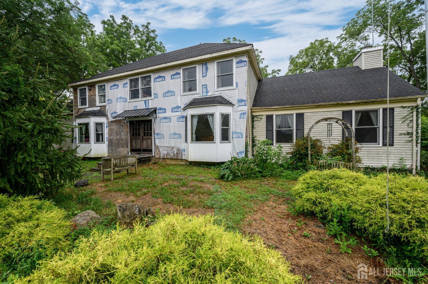 16 Pinewood Lane Washington, NJ 07882 - Photo 42 of 45 a front view of a house with a yard
