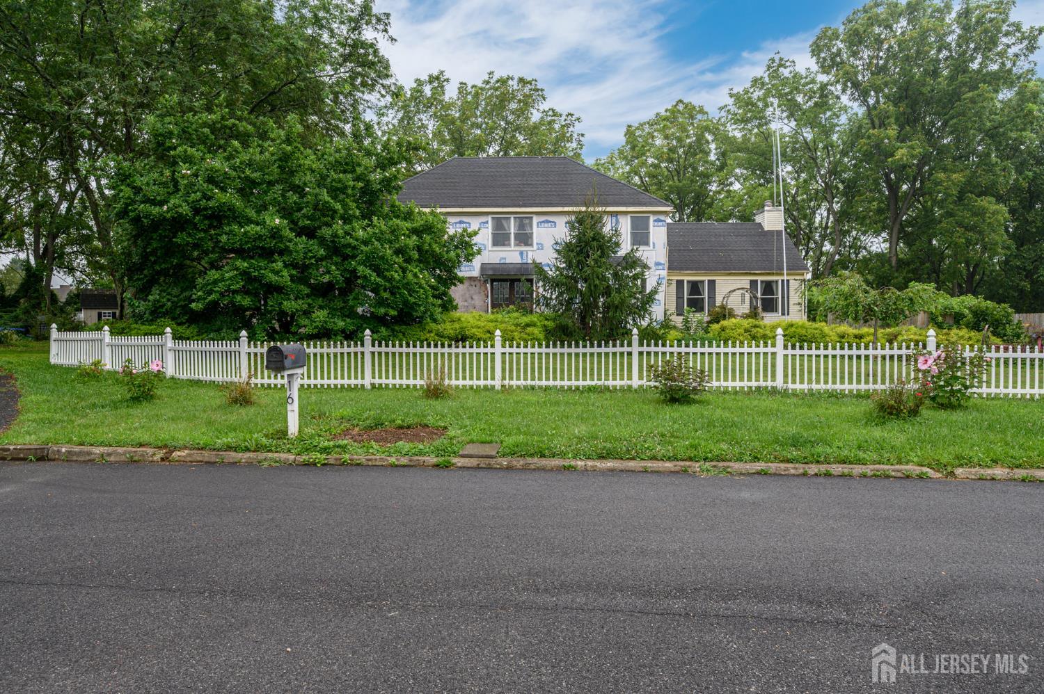 16 Pinewood Lane Washington, NJ 07882 - Photo 43 of 45 a view of a house with a big yard and potted plants