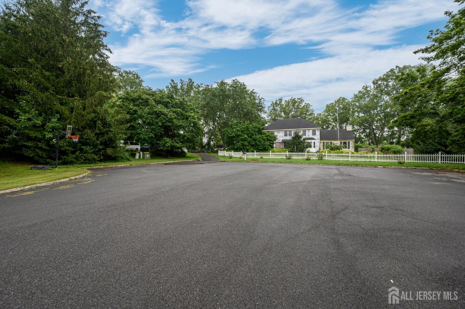 16 Pinewood Lane Washington, NJ 07882 - Photo 45 of 45 a view of a road with a big yard and a large tree