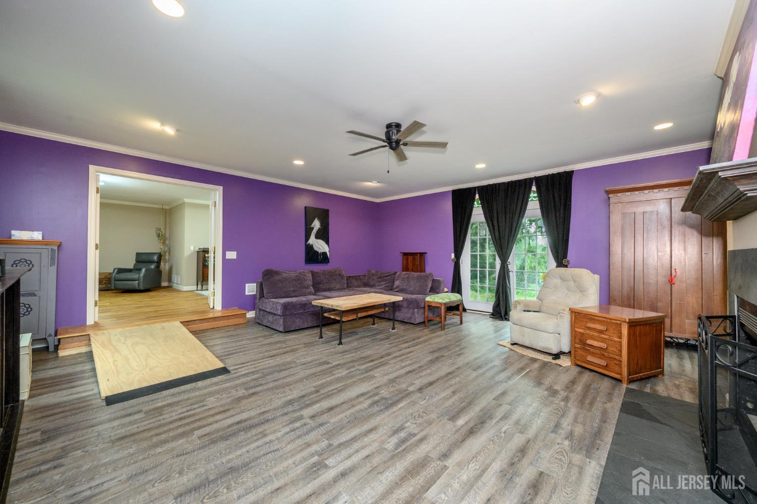 16 Pinewood Lane Washington, NJ 07882 - Photo 7 of 45 a living room with furniture and a wooden floor