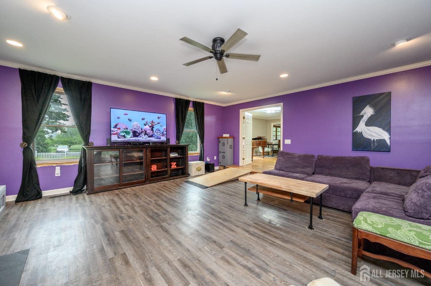 16 Pinewood Lane Washington, NJ 07882 - Photo 8 of 45 a living room with furniture and a flat screen tv