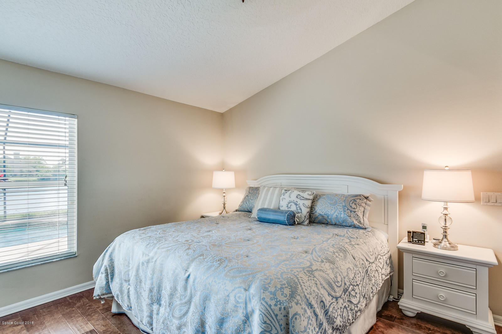 1253 Foxridge Place Melbourne, FL 32940 - Photo 14 of 22 a bedroom with a bed and a window