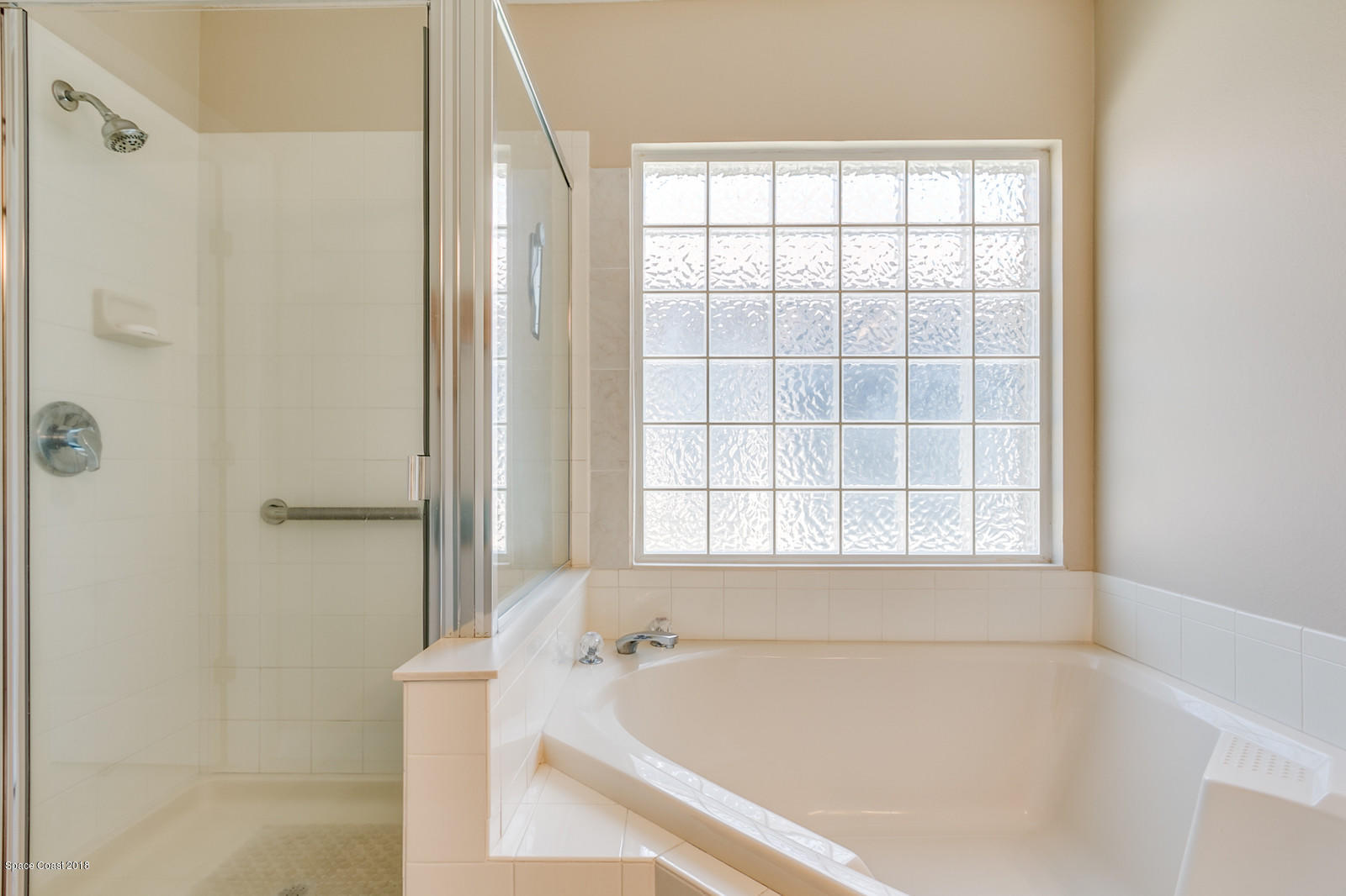 1253 Foxridge Place Melbourne, FL 32940 - Photo 16 of 22 a white bath tub sitting next to a window