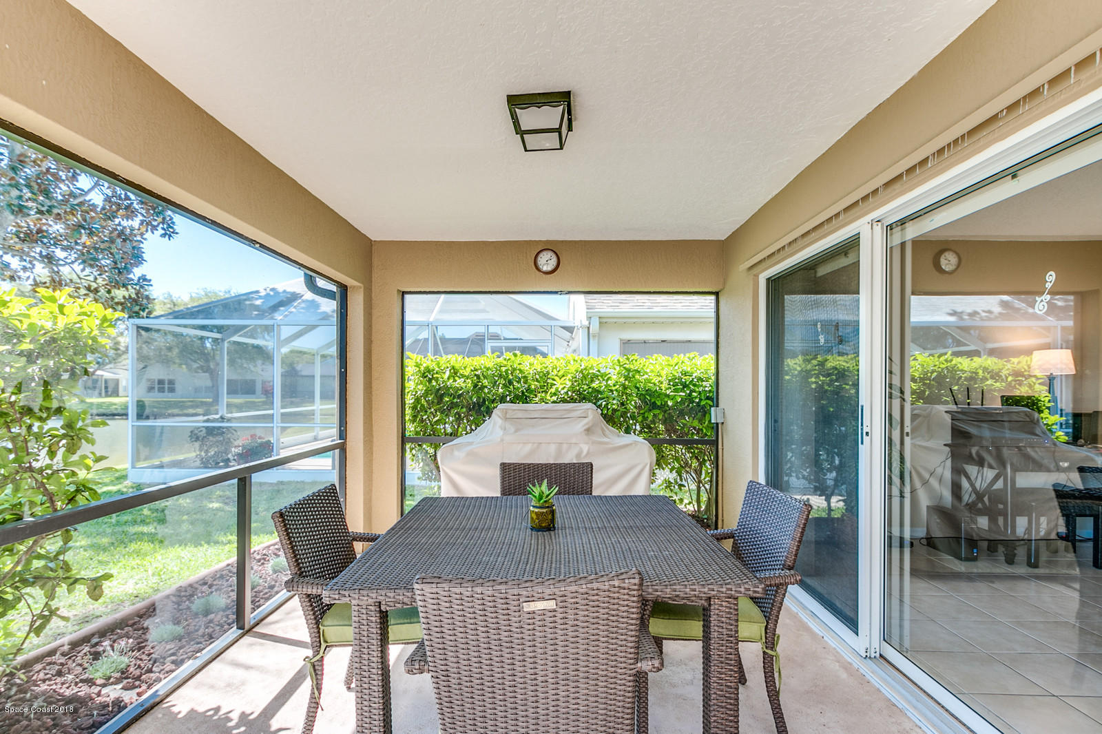 1253 Foxridge Place Melbourne, FL 32940 - Photo 18 of 22 a view of a patio with a table chairs and a table