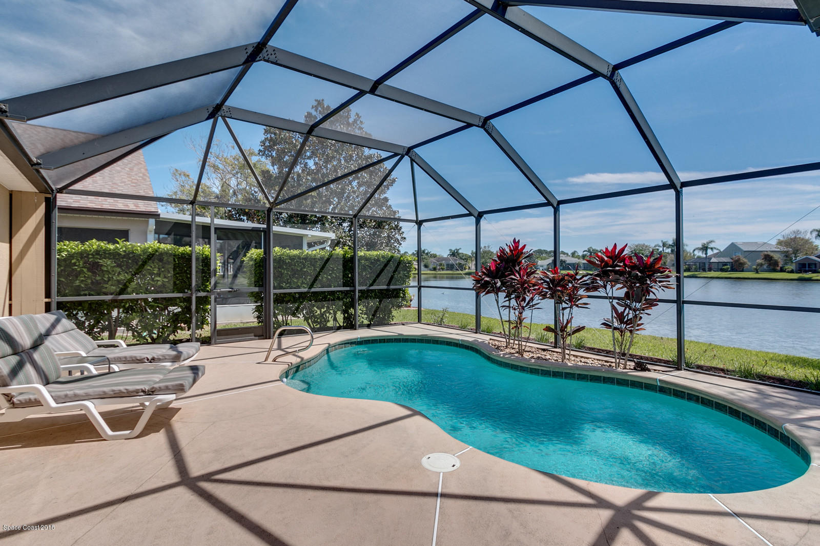 1253 Foxridge Place Melbourne, FL 32940 - Photo 20 of 22 a view of a swimming pool with a patio
