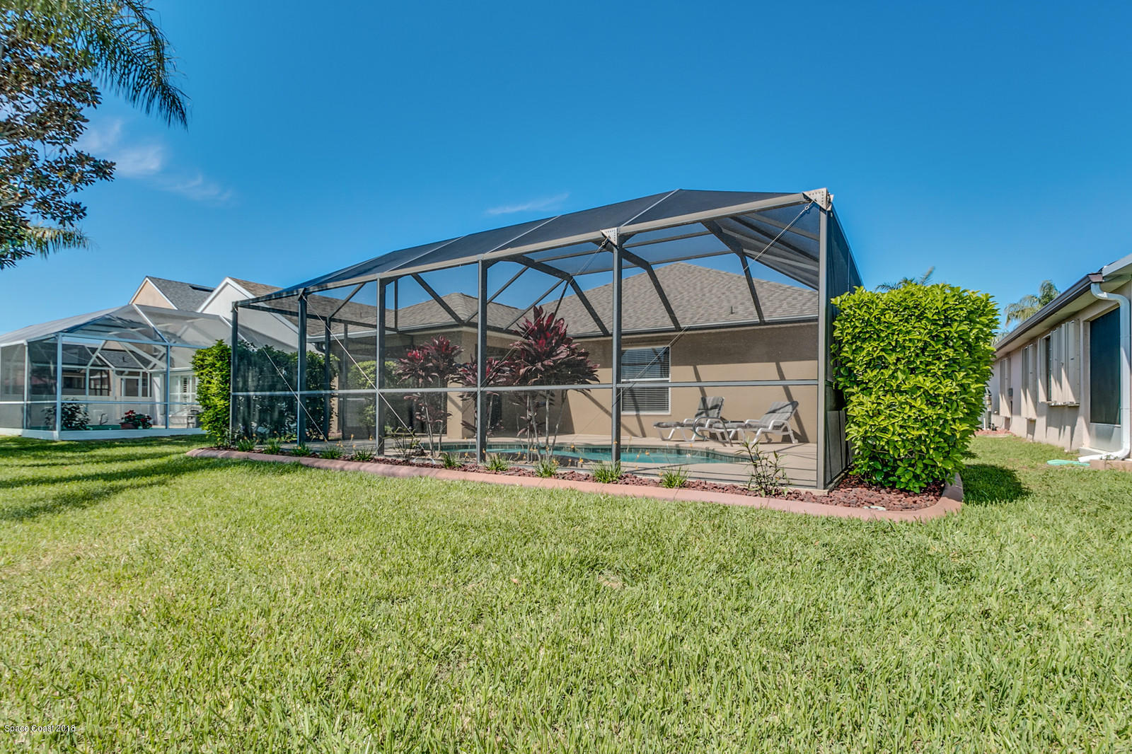 1253 Foxridge Place Melbourne, FL 32940 - Photo 21 of 22 a view of a house with a yard and sitting area