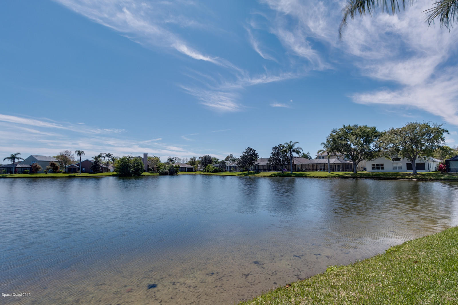 1253 Foxridge Place Melbourne, FL 32940 - Photo 22 of 22 a view of a lake with houses